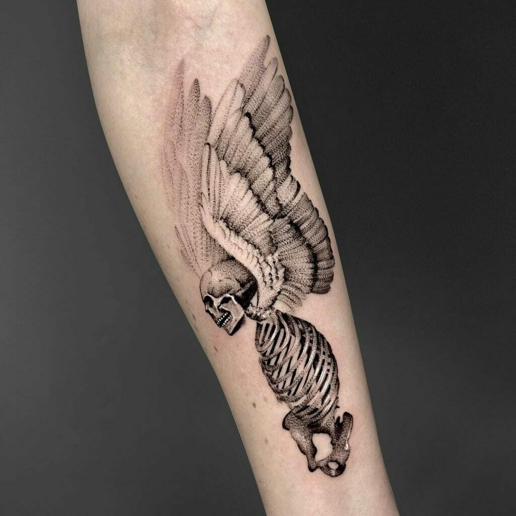 small wing tattoo on forearm 0085