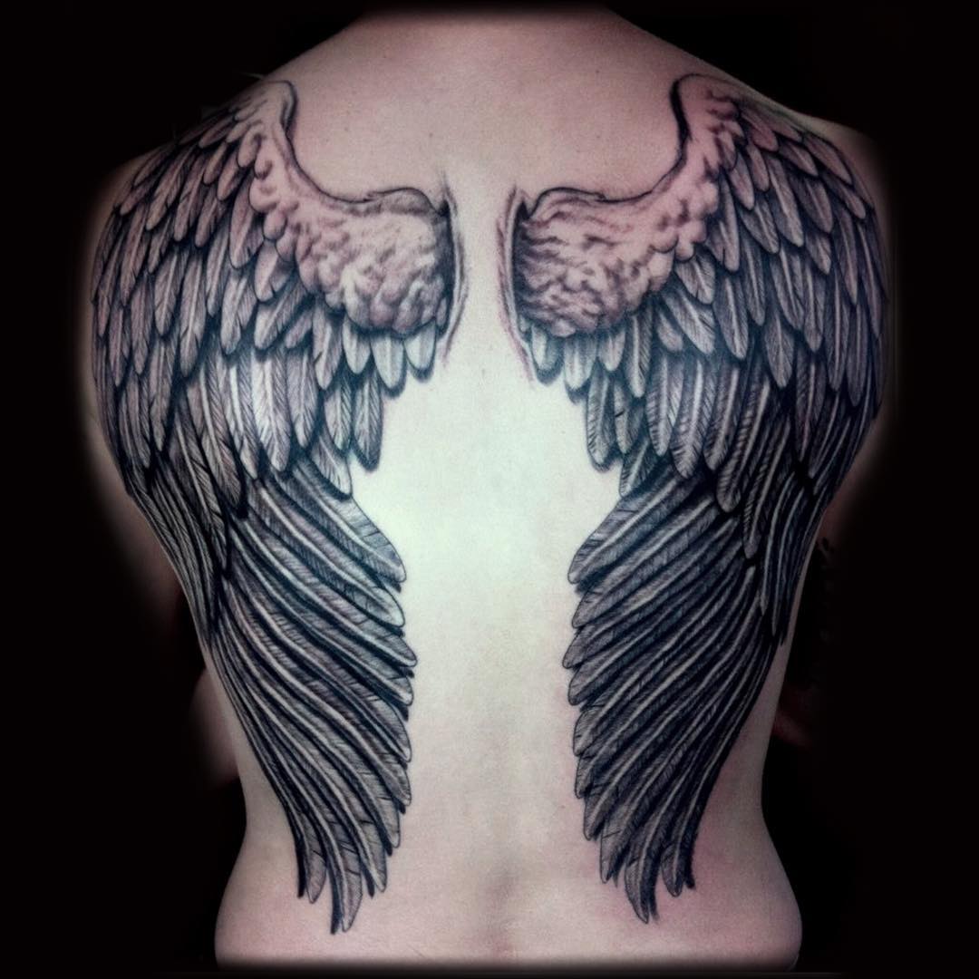 small wing tattoo on forearm 0091