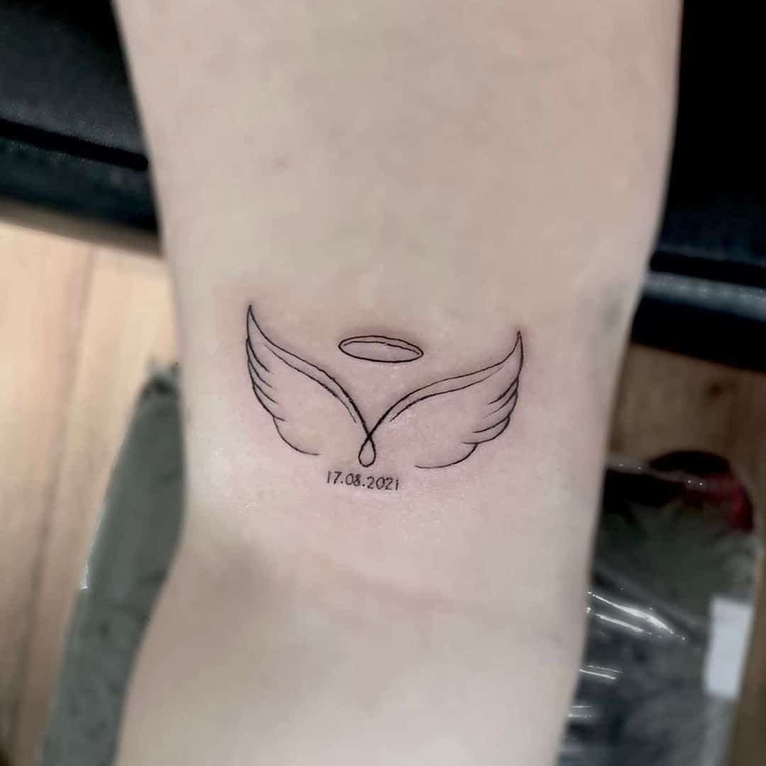 small wing tattoo on forearm 0094