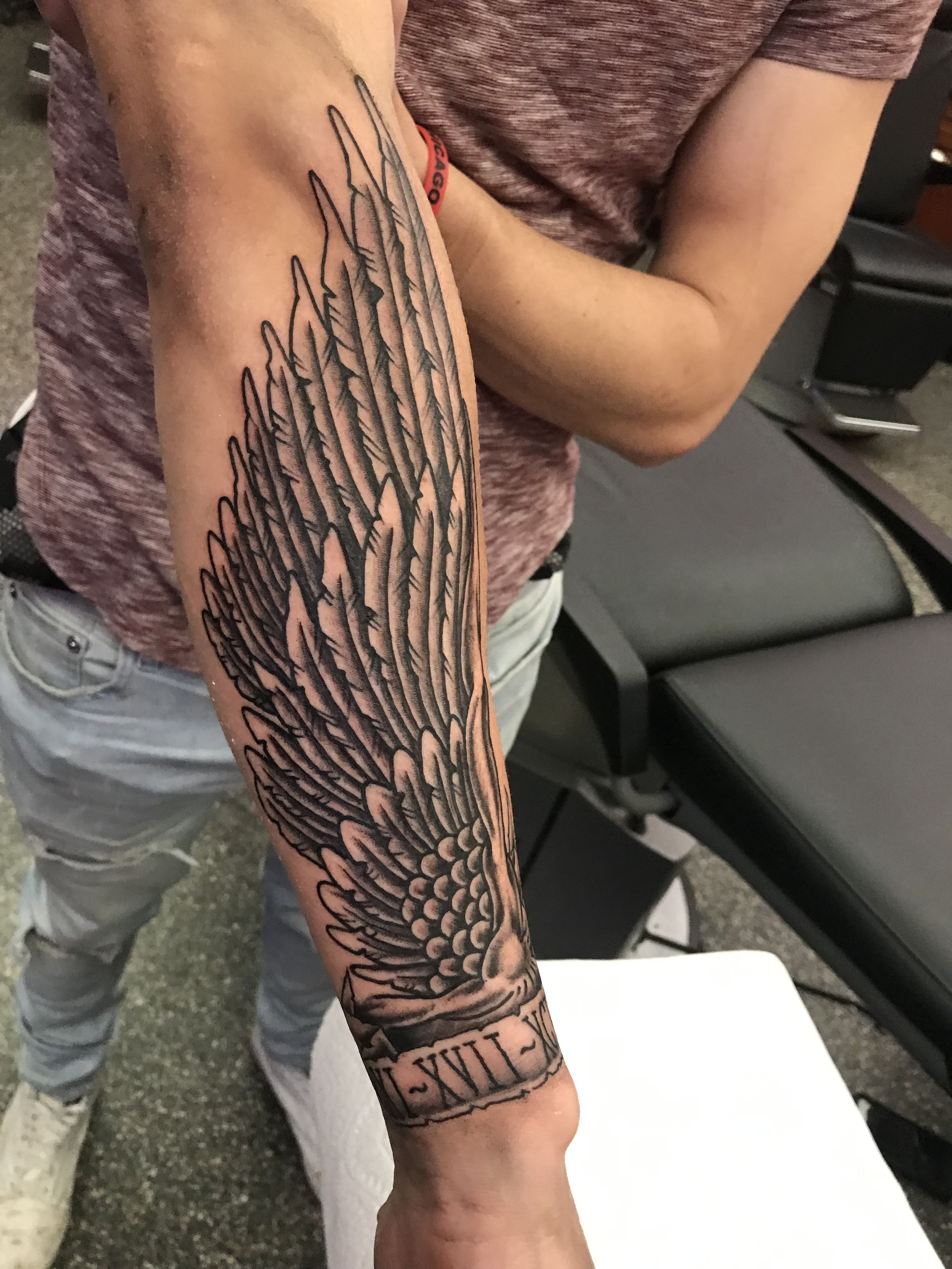 small wing tattoo on forearm 0095