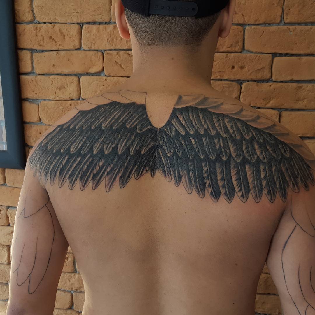 small wing tattoo on forearm 0097