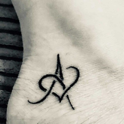 subtle letter tattoo ideas for first tattoos