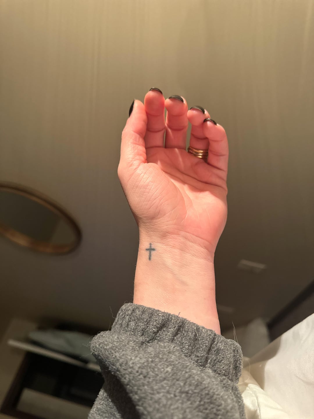 subtle small cross tattoos for women.