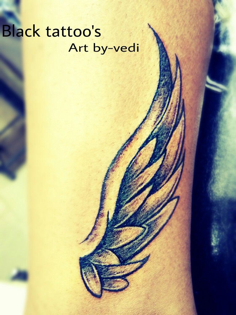 subtle small wing tattoo on forearm variations