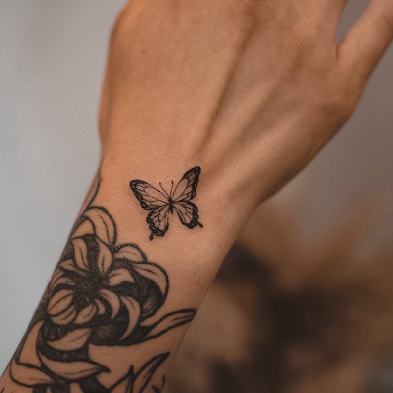 tiny butterfly tattoo on wrist