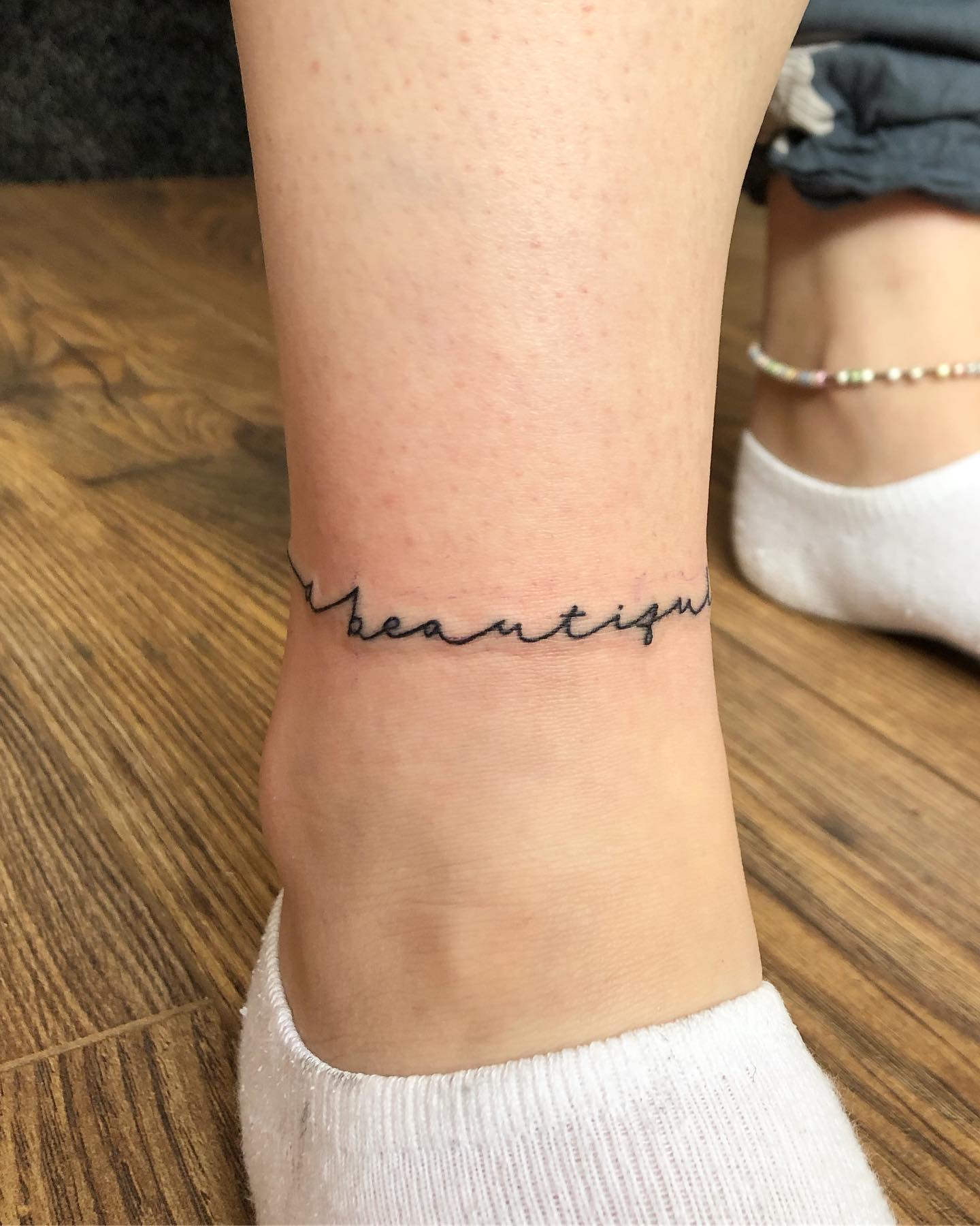 trendy ankle chain tattoo styles