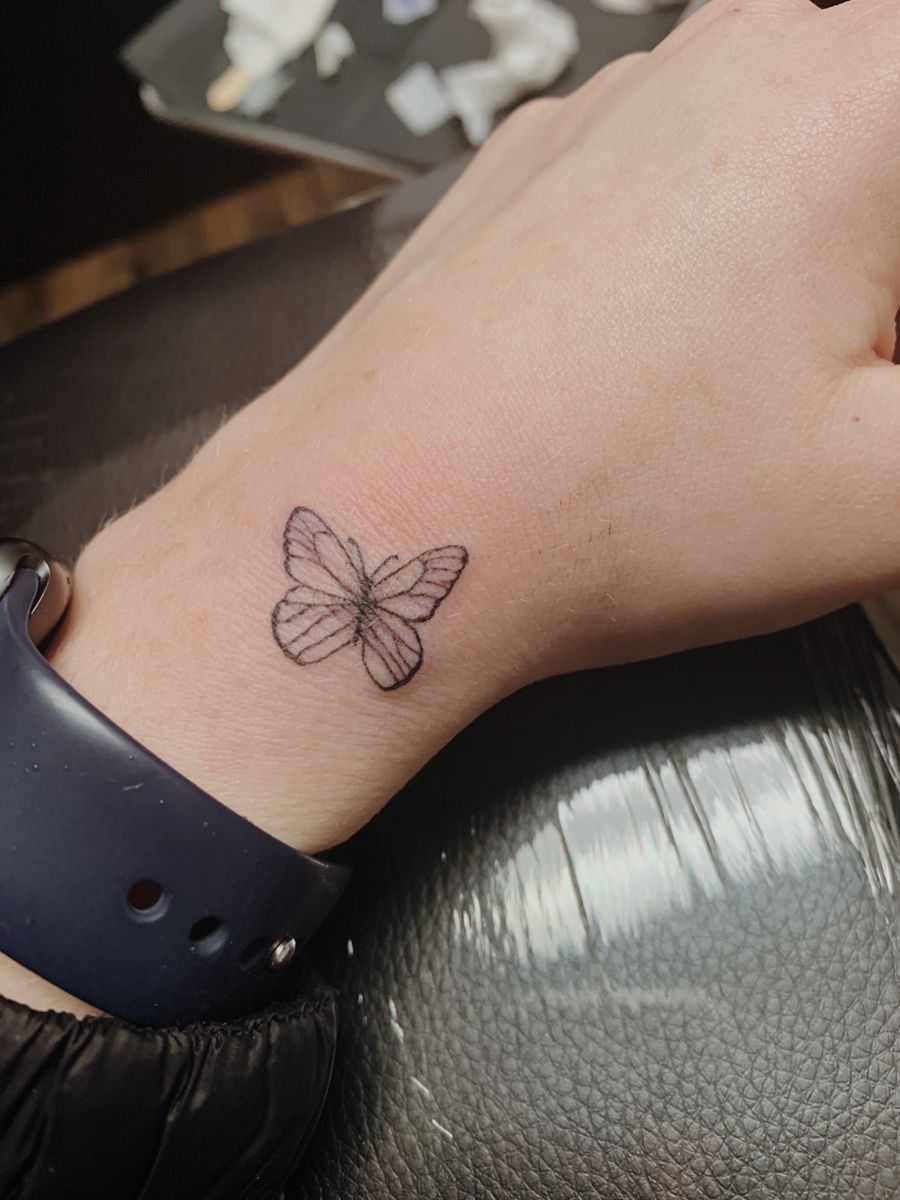 trendy small butterfly hand tattoo themes