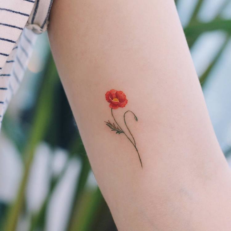 trendy wrist poppy tattoo styles.