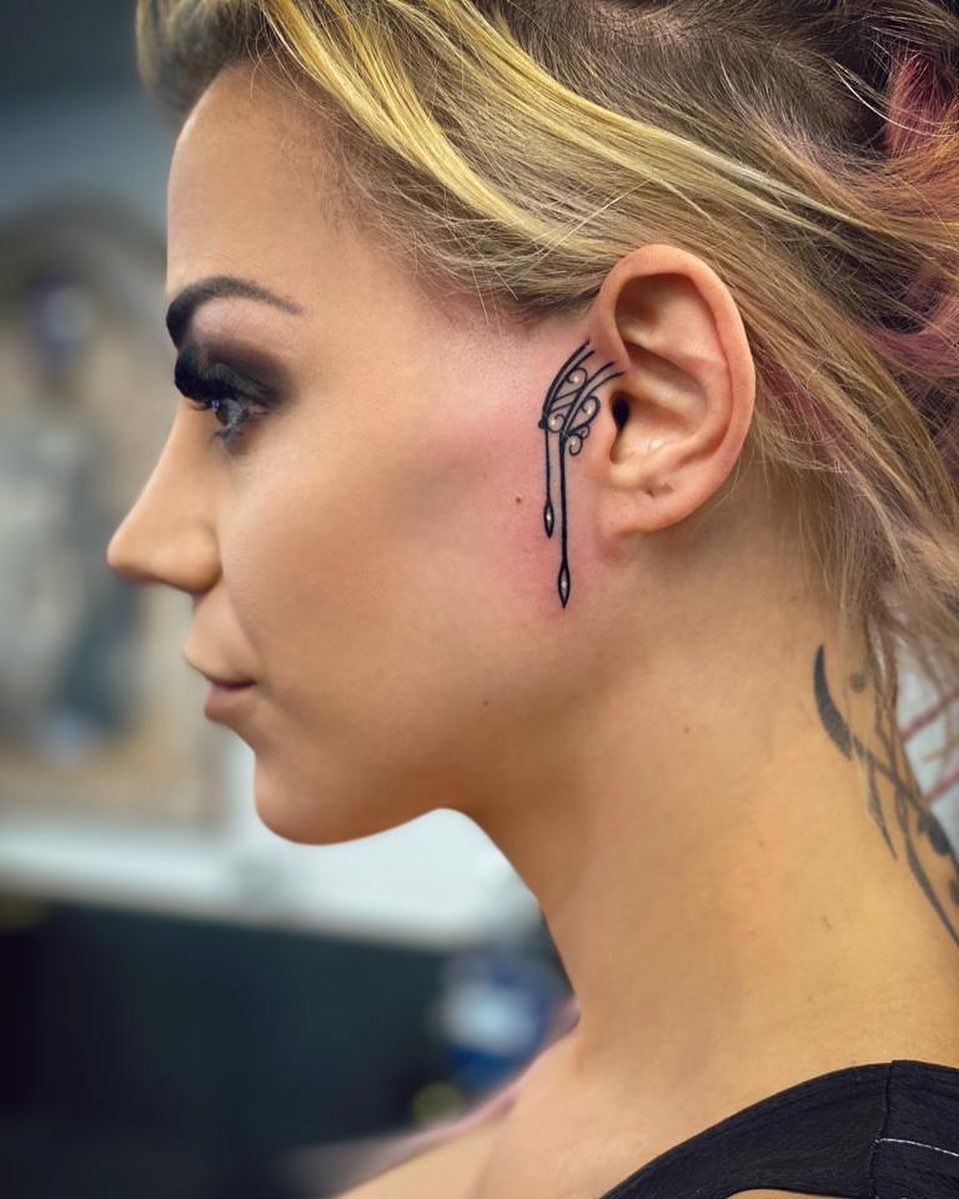 unique small side face tattoo suggestions for women