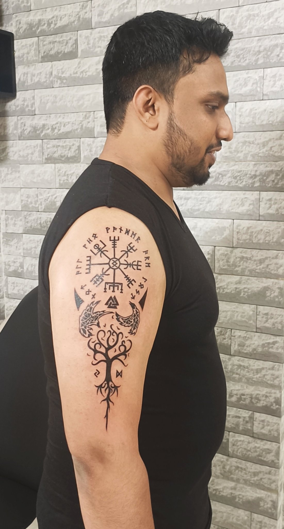 Viking tattoo ideas for men with Norse symbols