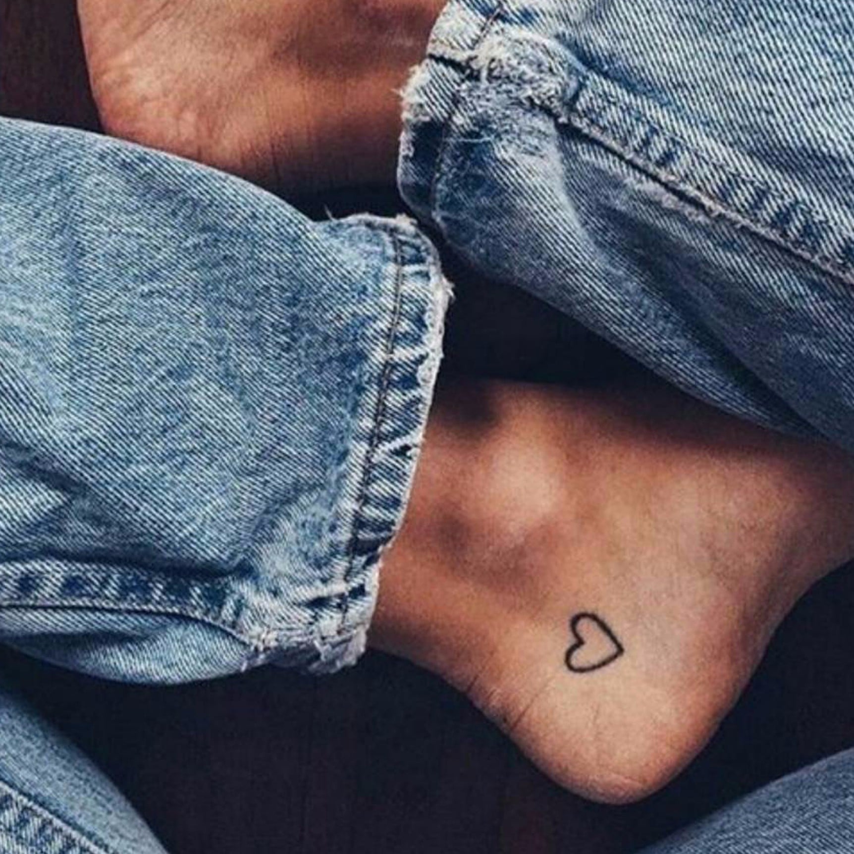 Small ankle tattoo celebrated for its intricate and personal designs