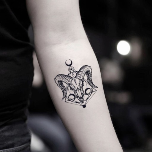 Small skull tattoo celebrated for its edgy and artistic appeal among enthusiasts