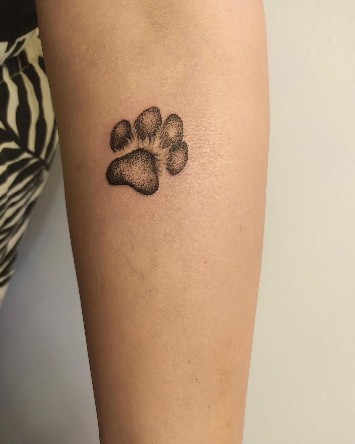 Adorned with love and memories dog paw print tattoo ideas for you