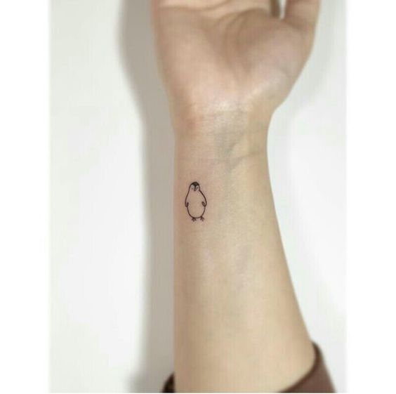 Minimalist small penguin tattoo designs that celebrate your individuality