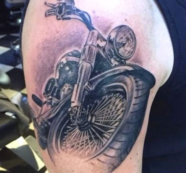 Moto tattoo ideas that celebrate freedom and a love for the open road