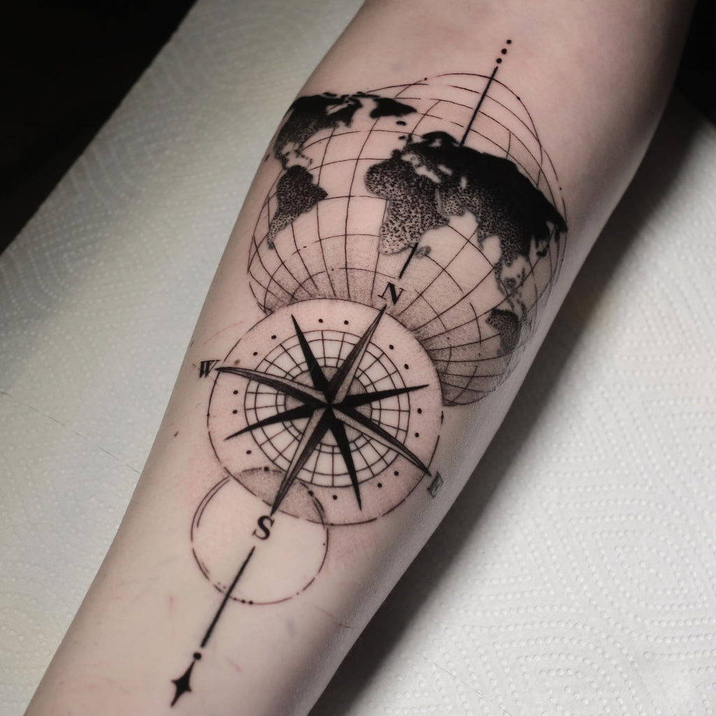 Small feminine compass tattoo evoked the spirit of adventure and freedom