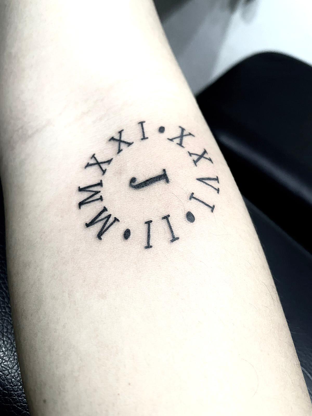 Small roman numerals tattoo ideas to express your unique story with inkspired