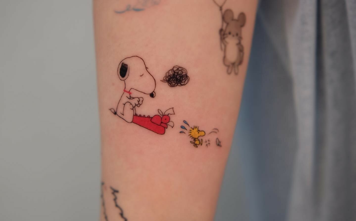 Snoopy tattoo ideas portrayed in creative designs for every fan