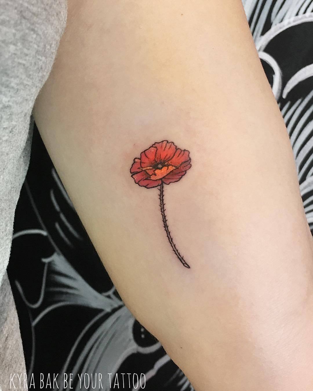 Wrist poppy tattoo small imprinted on your skin as a lasting symbol